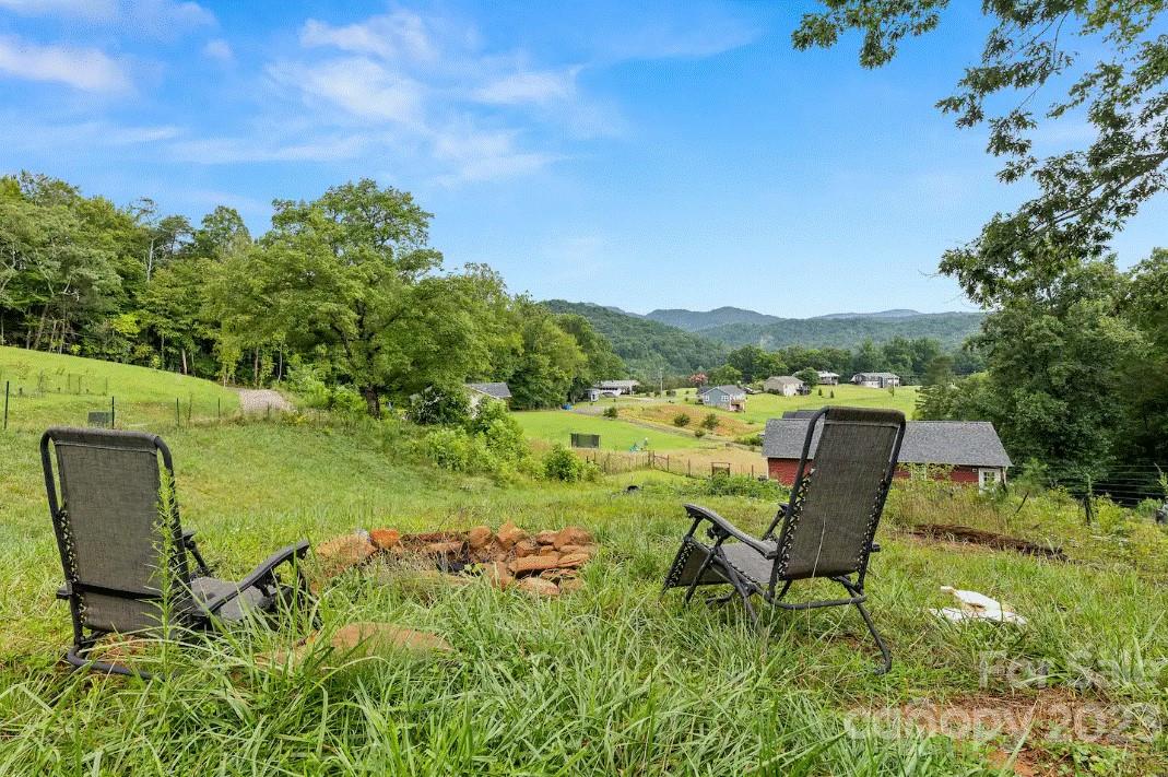 231 Medford Branch Road Candler, NC 28715 - Photo 28 of 28 a view of a chairs in a backyard