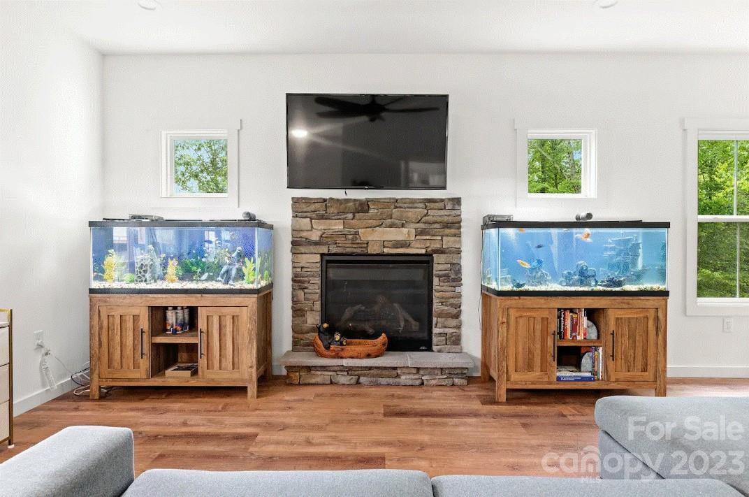 231 Medford Branch Road Candler, NC 28715 - Photo 6 of 28 a living room with furniture and a fireplace