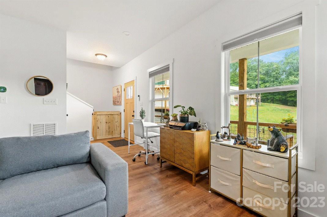 231 Medford Branch Road Candler, NC 28715 - Photo 7 of 28 a living room with furniture and a large window