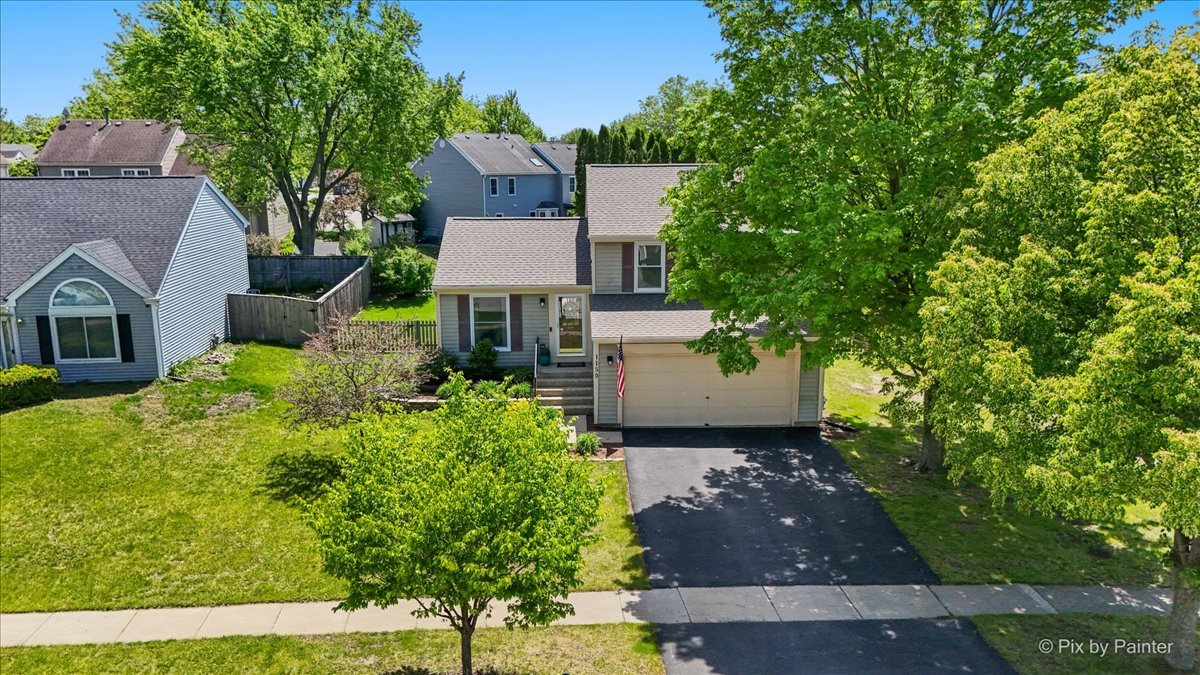 1150 Appleton Lane Geneva, IL 60134 - Photo 35 of 43 a front view of a house with a yard and fountain