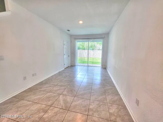 a view of an empty room and window