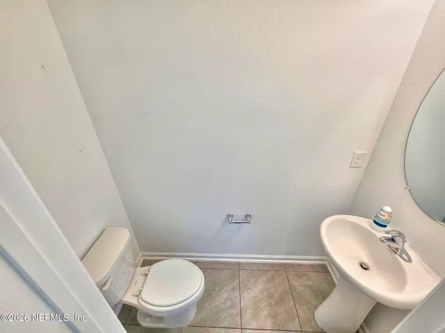 a bathroom with a toilet and a sink