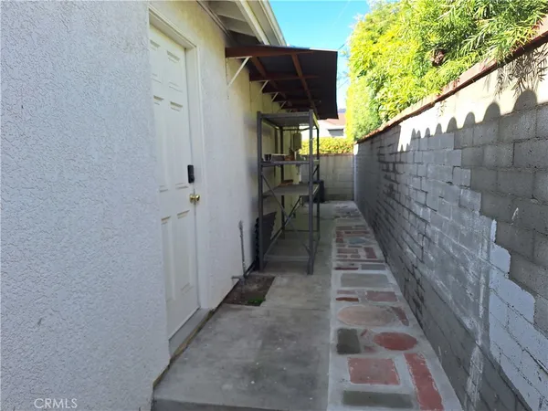 a view of a pathway of a building with wooden floor