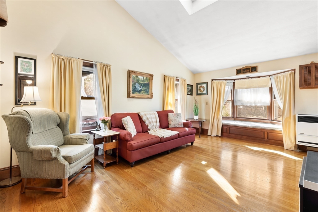 142 Bancroft Avenue Reading, MA 01867 - Photo 12 of 30 a living room with furniture and a large window