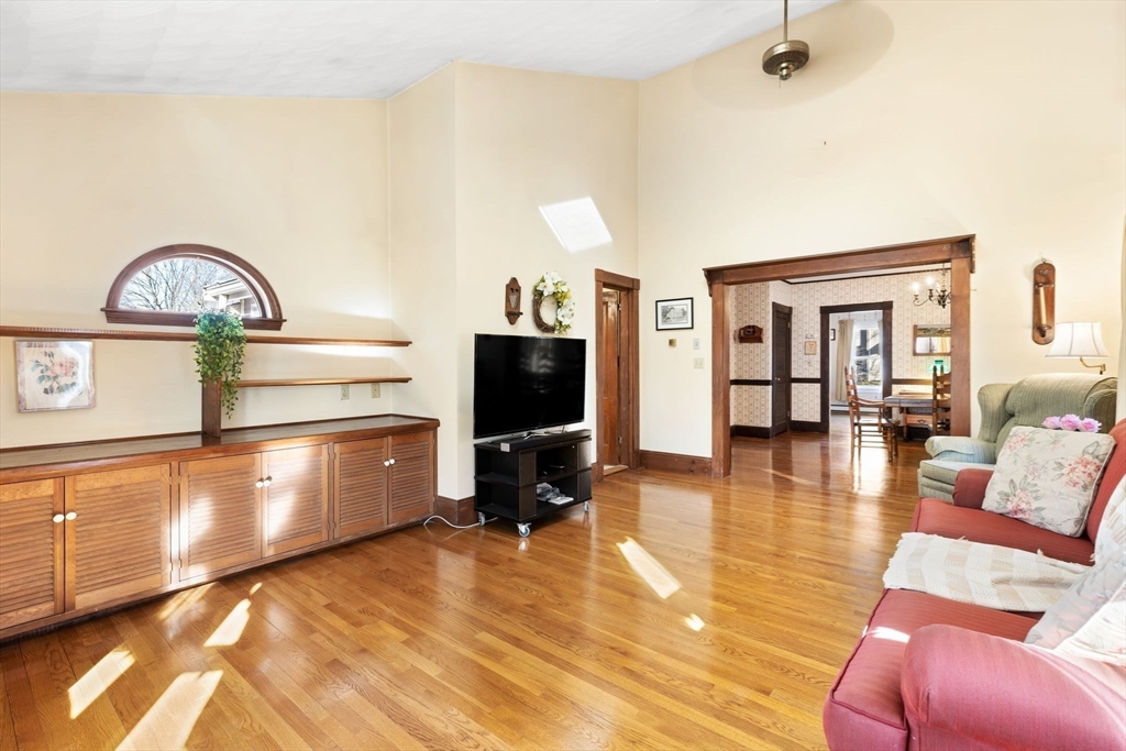 142 Bancroft Avenue Reading, MA 01867 - Photo 13 of 30 a living room with furniture and a flat screen tv