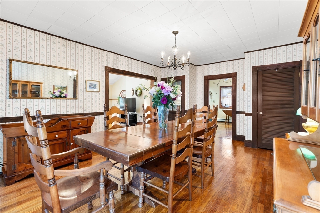 142 Bancroft Avenue Reading, MA 01867 - Photo 15 of 30 a view of a dining room with furniture and wooden floor