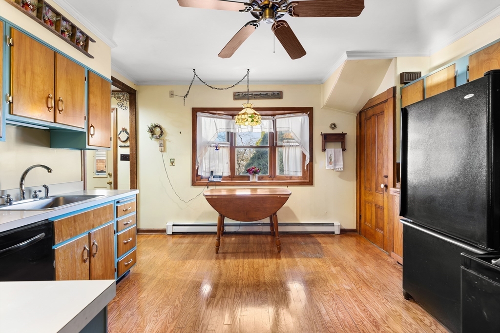 142 Bancroft Avenue Reading, MA 01867 - Photo 16 of 30 a room with stainless steel appliances wooden floor and chandelier