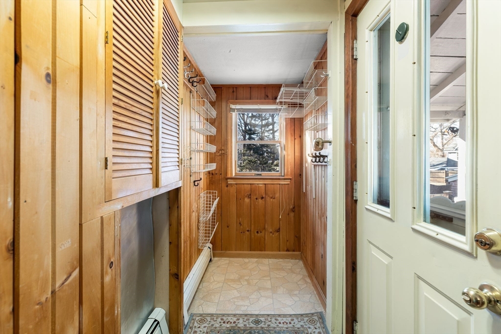 142 Bancroft Avenue Reading, MA 01867 - Photo 18 of 30 a view of a hallway with windows