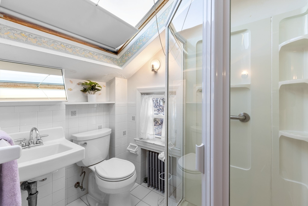 142 Bancroft Avenue Reading, MA 01867 - Photo 22 of 30 a bathroom with a toilet sink and a mirror