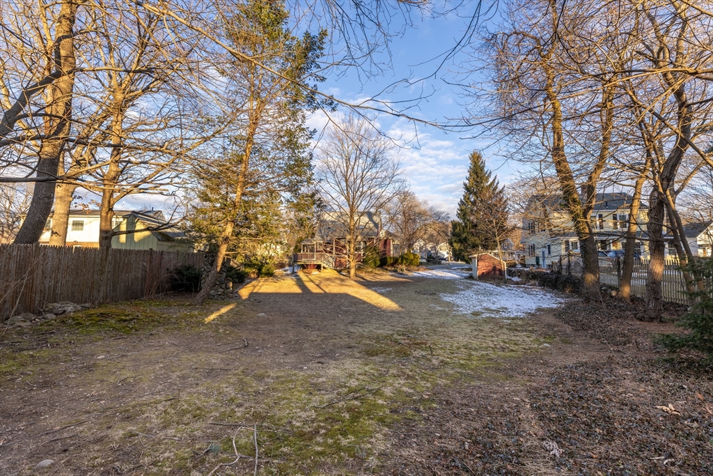 142 Bancroft Avenue Reading, MA 01867 - Photo 27 of 30 a view of road with large trees