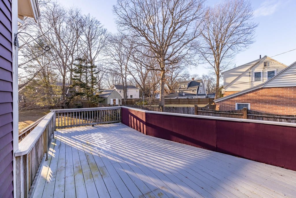142 Bancroft Avenue Reading, MA 01867 - Photo 28 of 30 a view of balcony with wooden floor and outdoor seating