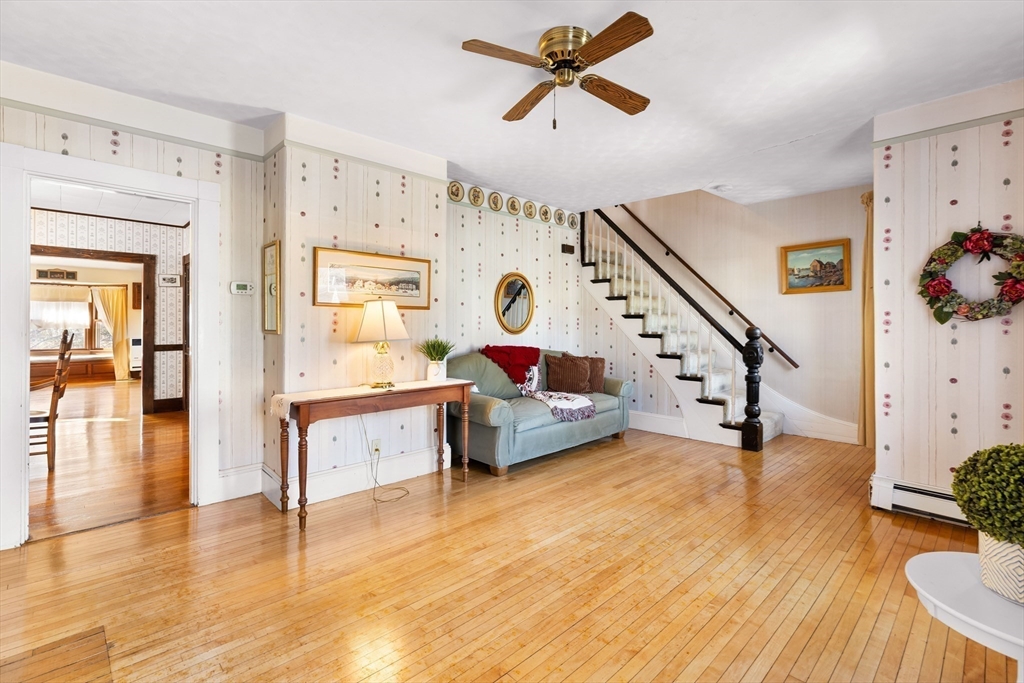 142 Bancroft Avenue Reading, MA 01867 - Photo 5 of 30 a living room with furniture and wooden floor