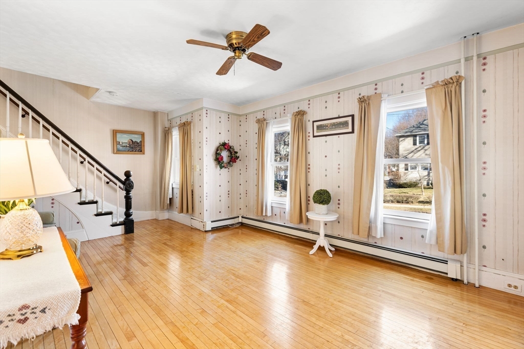 142 Bancroft Avenue Reading, MA 01867 - Photo 8 of 30 a view of livingroom with hardwood floor and ceiling fan