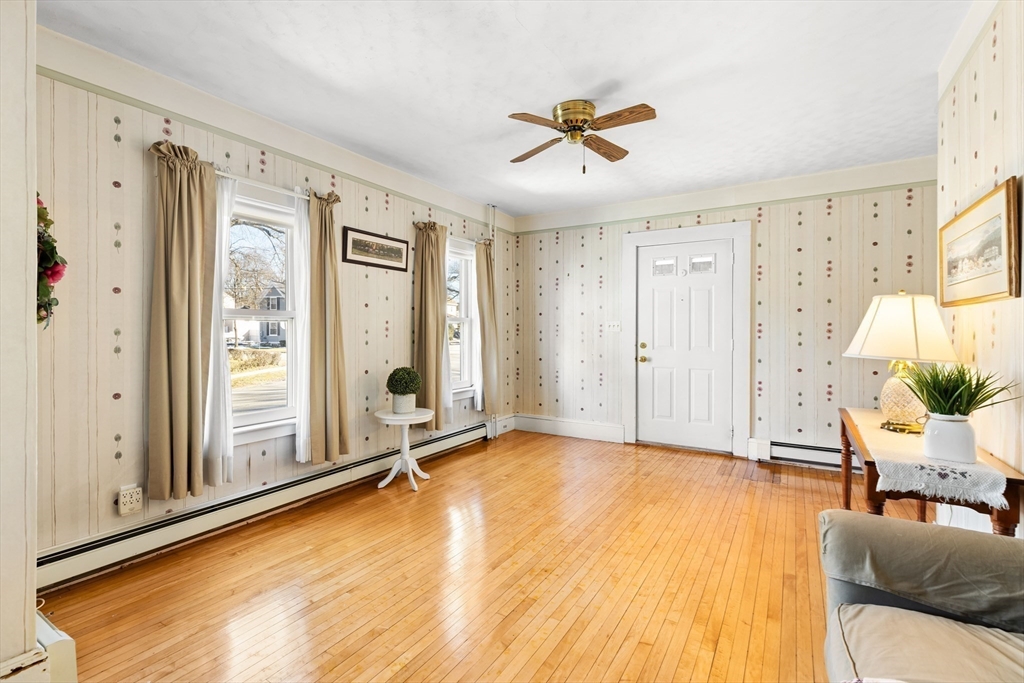 142 Bancroft Avenue Reading, MA 01867 - Photo 9 of 30 a living room with furniture and a large window