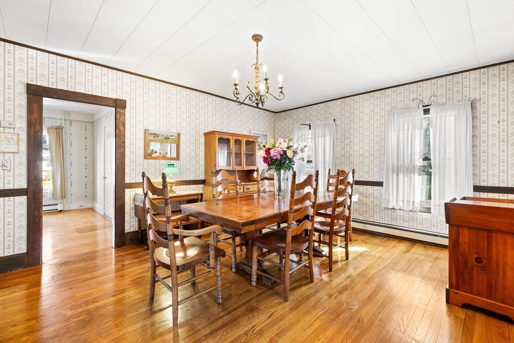 142 Bancroft Avenue Reading, MA 01867 - Photo 10 of 30 a view of a dining room with furniture window and wooden floor