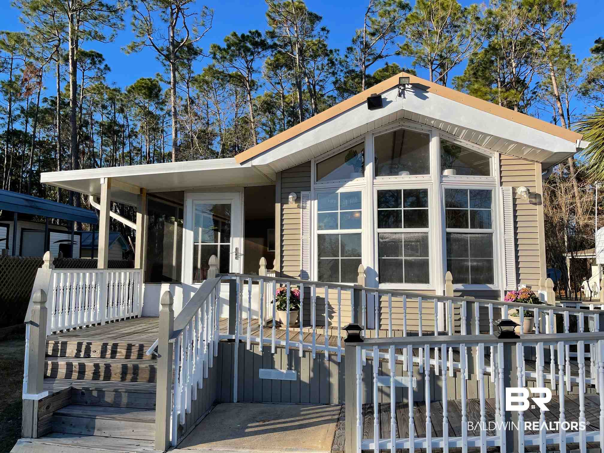 186 Defuniak Loop Lillian, AL 36549 - Photo 1 of 20 Wheelchair access, screened-in side porch.