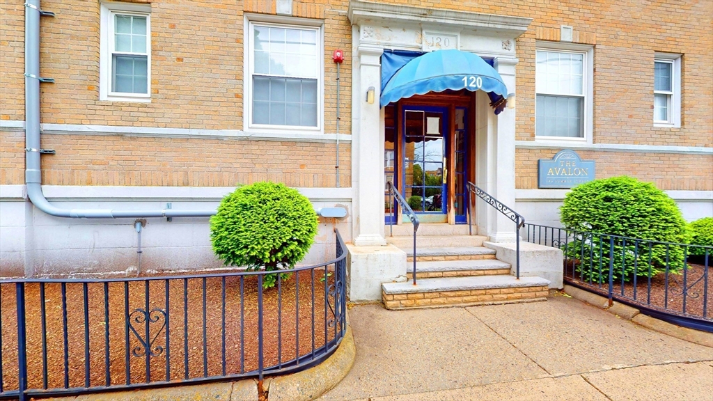 120 Summer Street, Unit 1 Malden, MA 02148 - Photo 11 of 14 a front view of a house with a garden