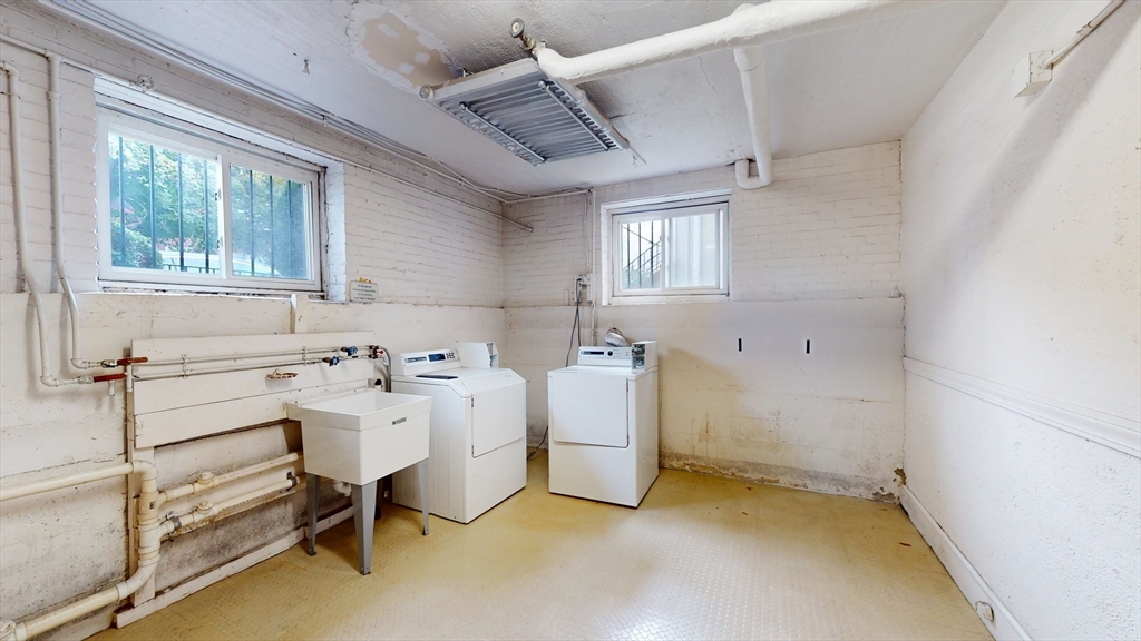 120 Summer Street, Unit 1 Malden, MA 02148 - Photo 13 of 14 a utility room with dryer and windows