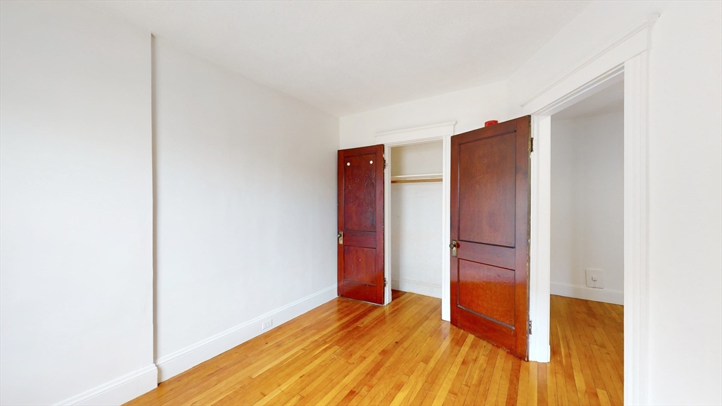 120 Summer Street, Unit 1 Malden, MA 02148 - Photo 9 of 14 a view of empty room with wooden floor