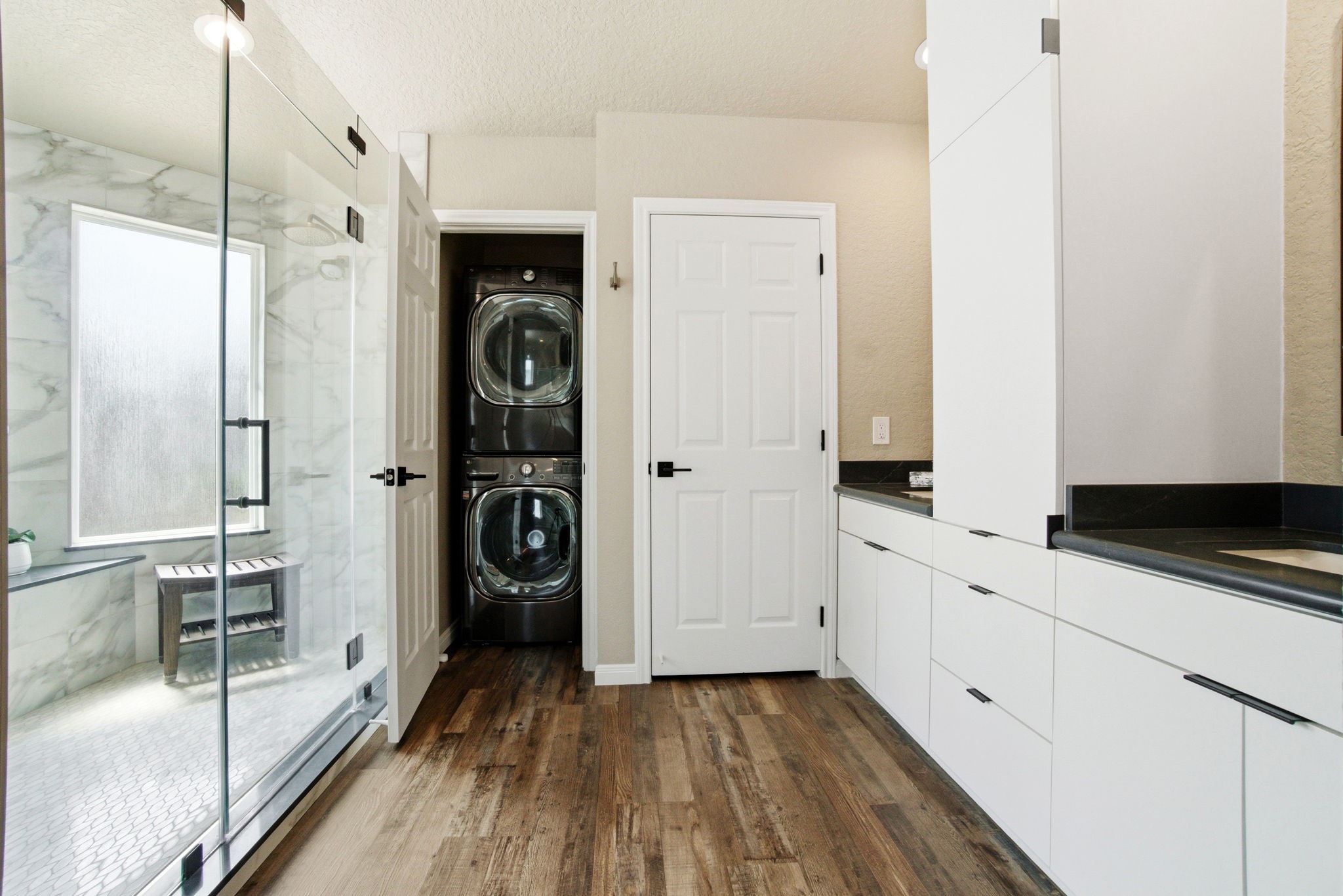 1609 Schooner Point Willis, TX 77318 - Photo 32 of 50 a kitchen with white cabinets and sink