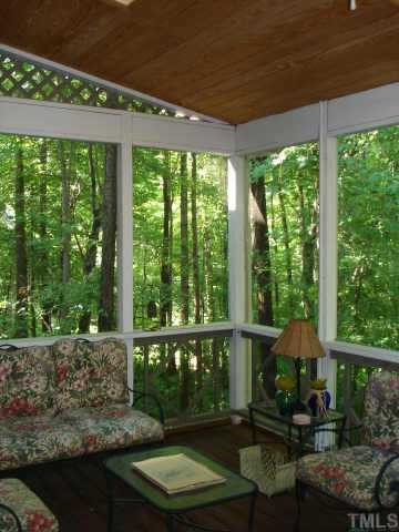 5501 North Hawthorne Way Raleigh, NC 27613 - Photo 8 of 10 a patio with lawn chairs and wooden floor