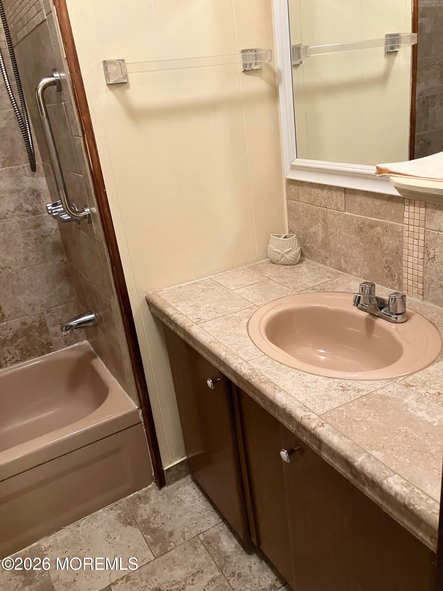 7 D Trail Brick, NJ 08724 - Photo 11 of 11 a bathroom with a granite countertop sink and a tub