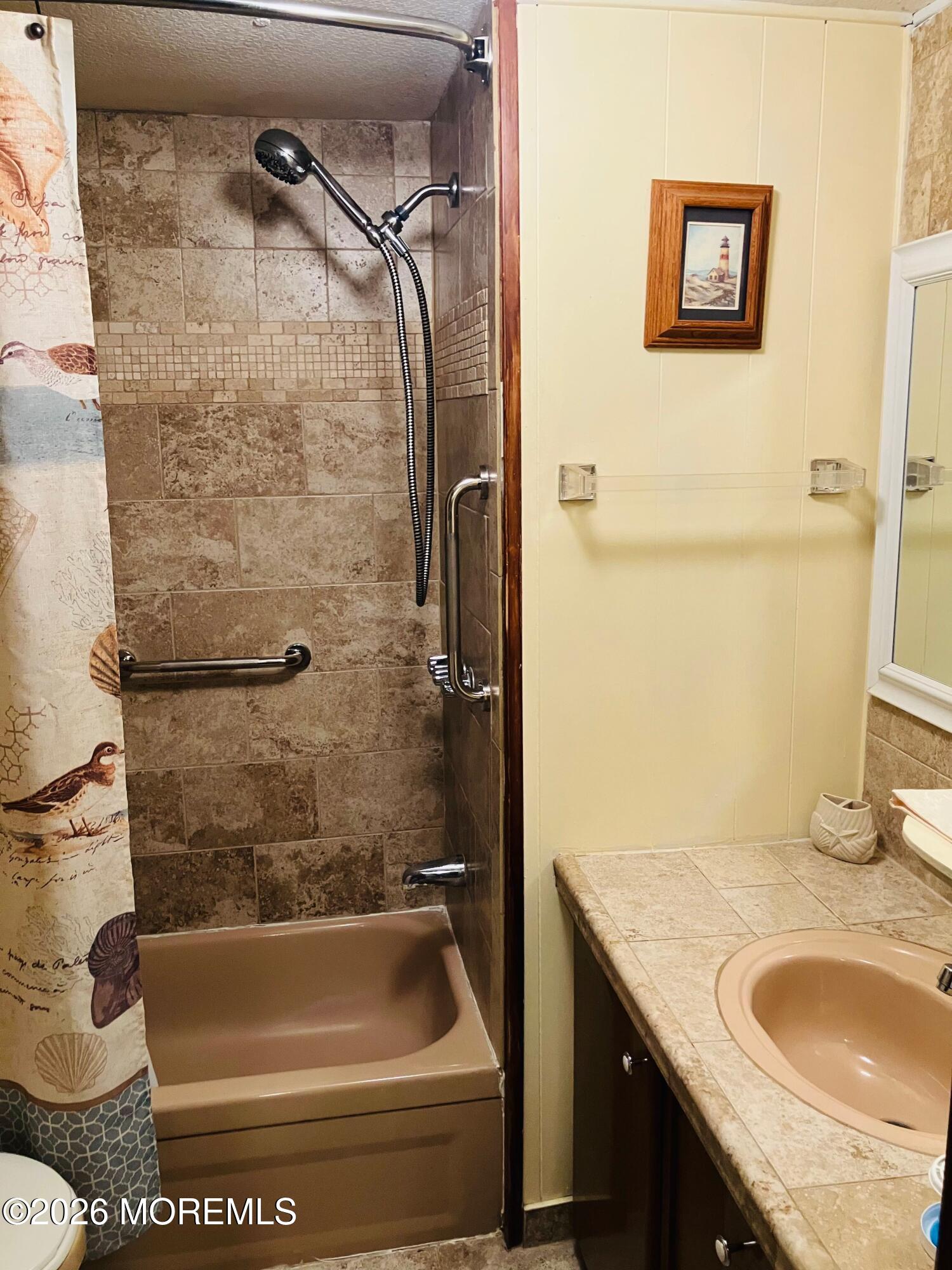 7 D Trail Brick, NJ 08724 - Photo 8 of 11 a bathroom with a granite countertop sink a toilet and bathtub