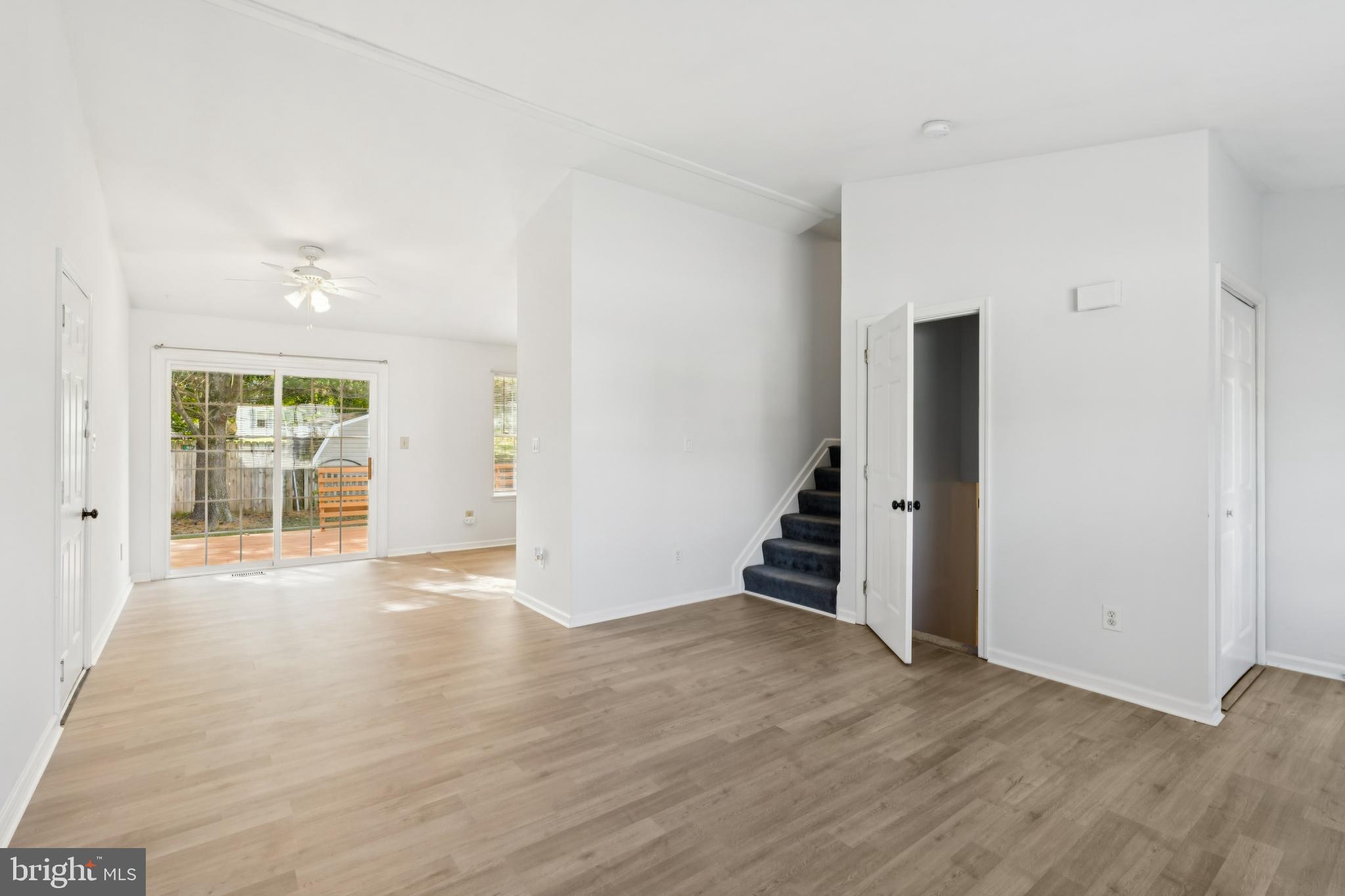 1151 Caton Road Hampstead, MD 21074 - Photo 16 of 43 an empty room with wooden floor and windows