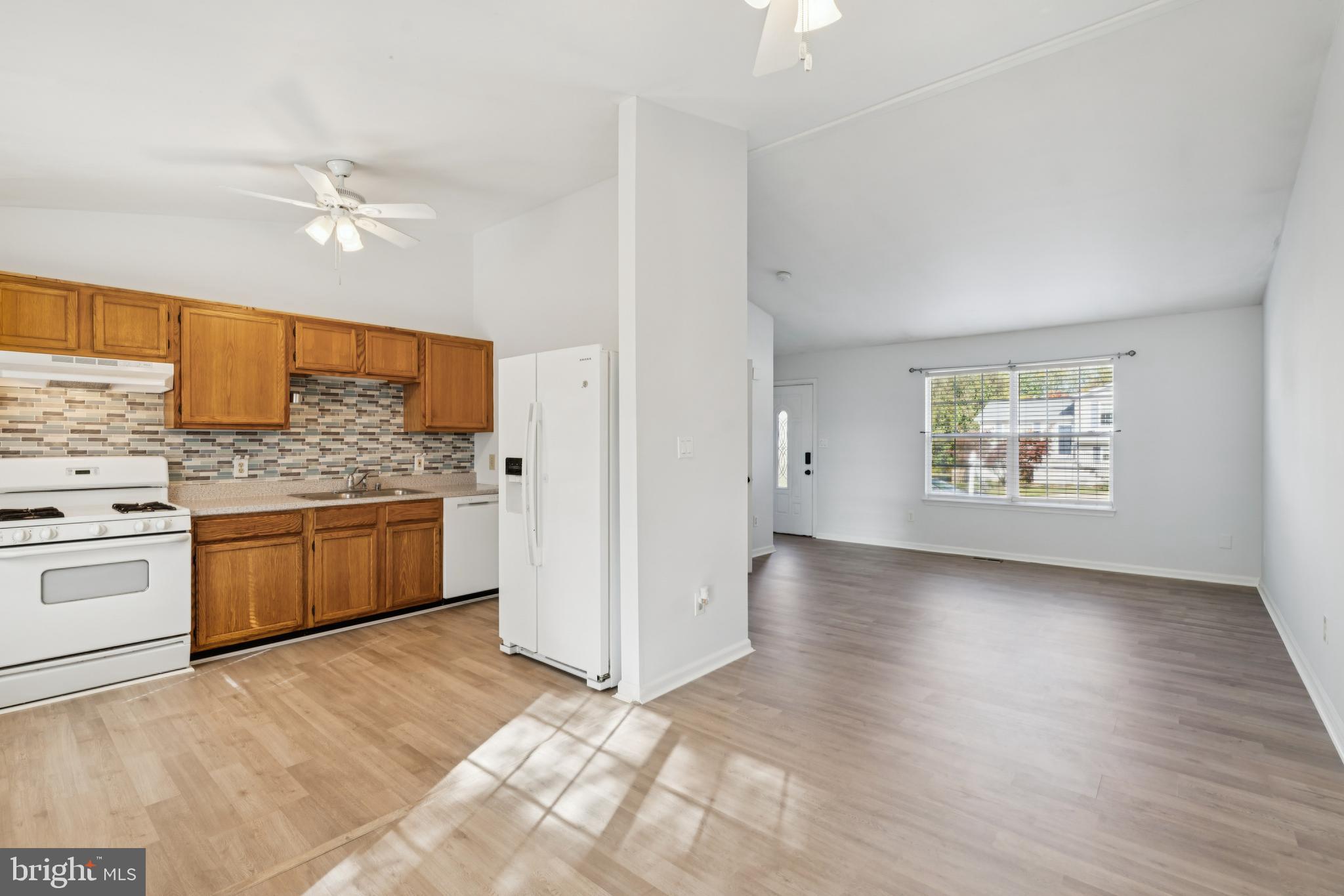 1151 Caton Road Hampstead, MD 21074 - Photo 18 of 43 a kitchen with stainless steel appliances a refrigerator sink and stove