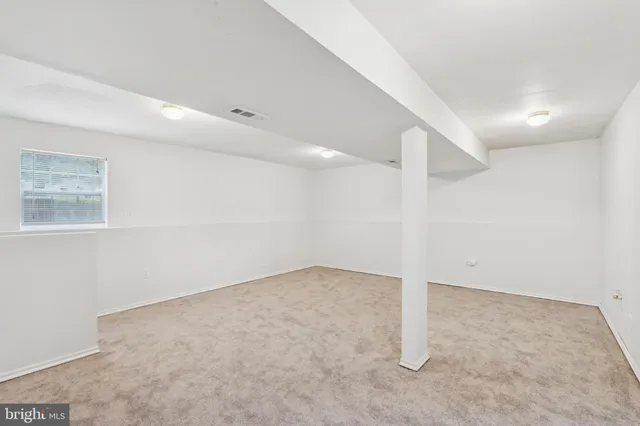 a view of a garage with white walls