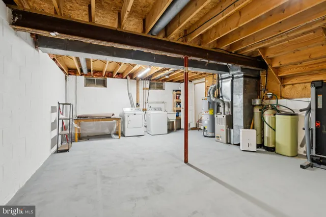 a bathroom with a toilet sink and a mirror