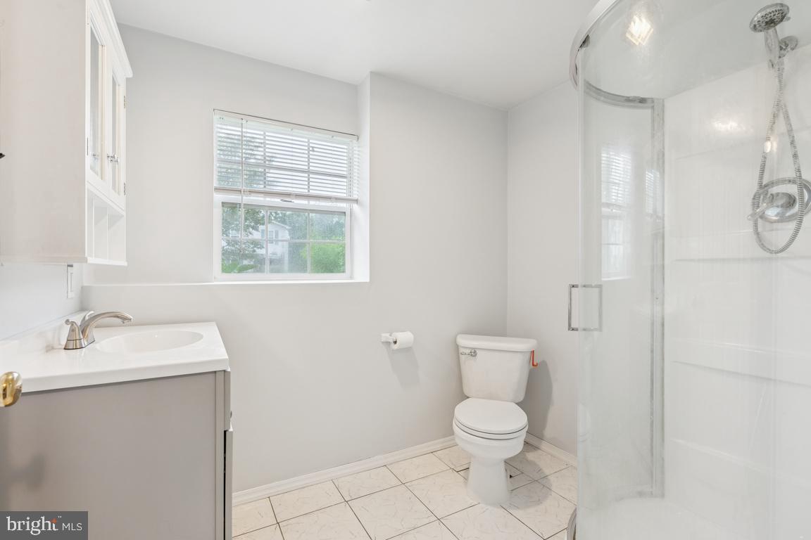 1151 Caton Road Hampstead, MD 21074 - Photo 25 of 43 a bathroom with a toilet sink and a mirror