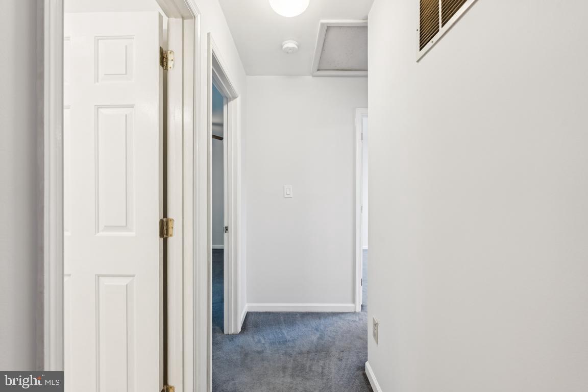 1151 Caton Road Hampstead, MD 21074 - Photo 28 of 43 a view of a hallway with wooden floor