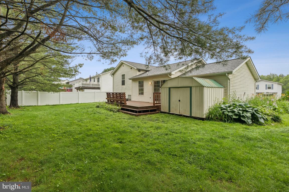 1151 Caton Road Hampstead, MD 21074 - Photo 43 of 43 a view of a house with a big yard plants and large tree