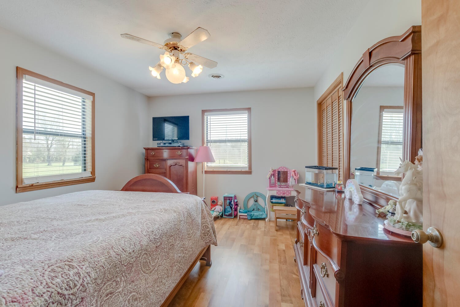 259 Toad Road Dowelltown, TN 37059 - Photo 7 of 19 a bedroom with a bed and a chandelier