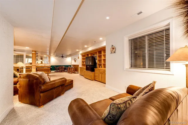 a view of a backyard with chairs