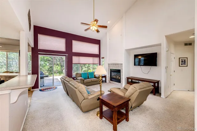 a bathroom with a granite countertop sink a bathtub and shower