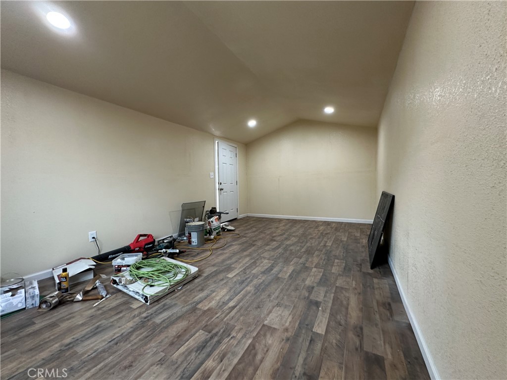 828 West 23rd Street Merced, CA 95340 - Photo 17 of 19 a view of room with wooden floor and air hockey table