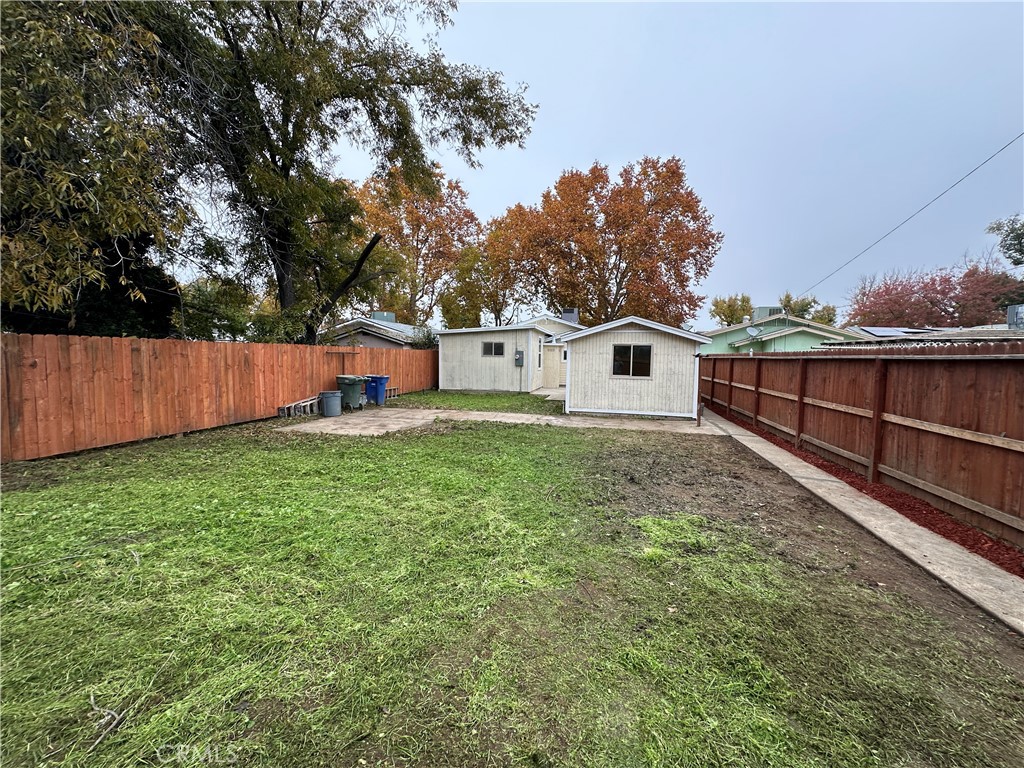 828 West 23rd Street Merced, CA 95340 - Photo 18 of 19 a view of a backyard with a small cabin