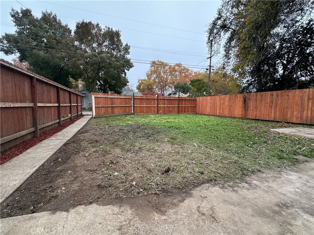 828 West 23rd Street Merced, CA 95340 - Photo 19 of 19 a view of backyard with wooden fence