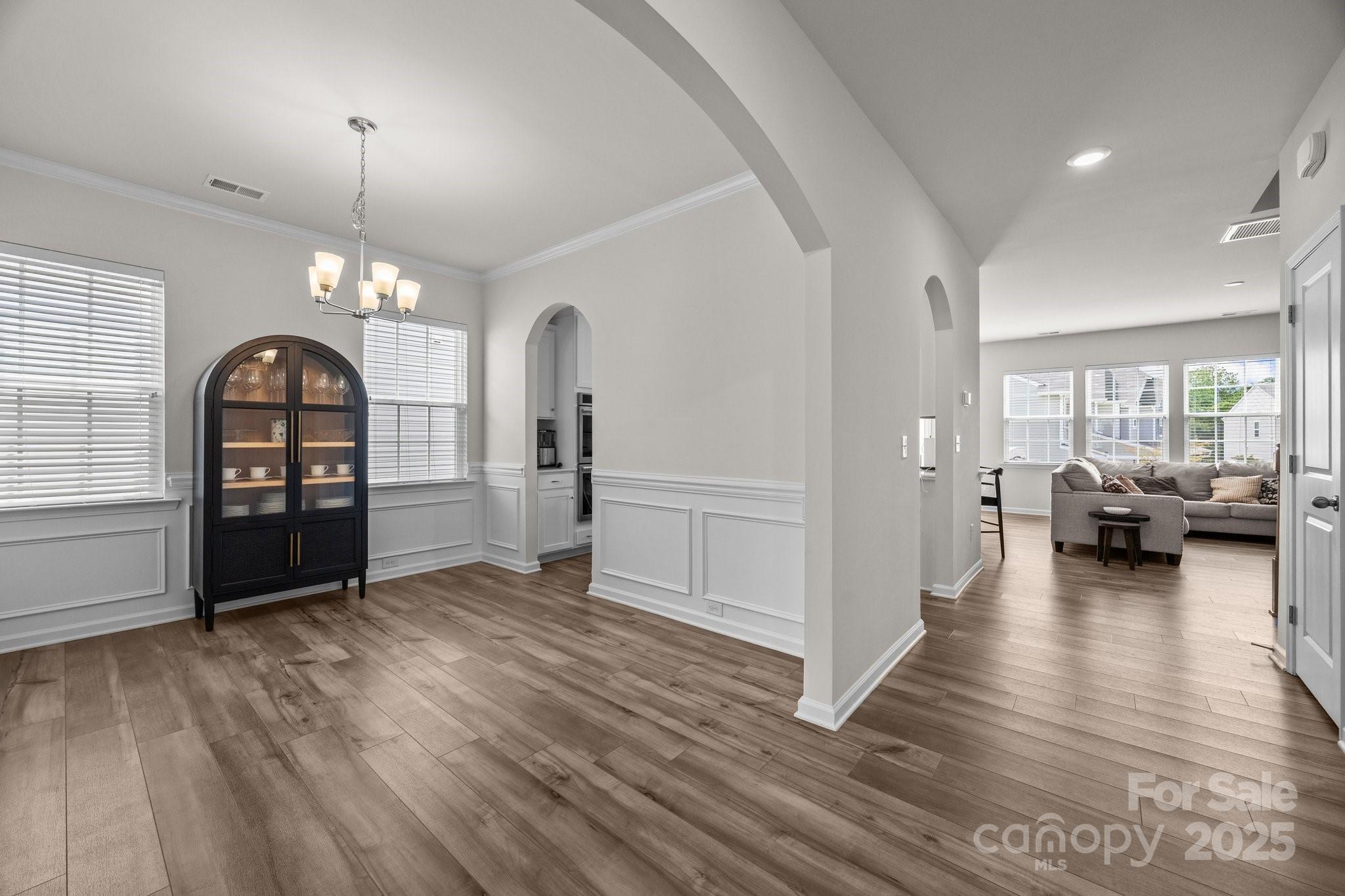 3643 Slider Terrace Lancaster, SC 29720 - Photo 12 of 46 a view of a livingroom with hardwood floor and a kitchen