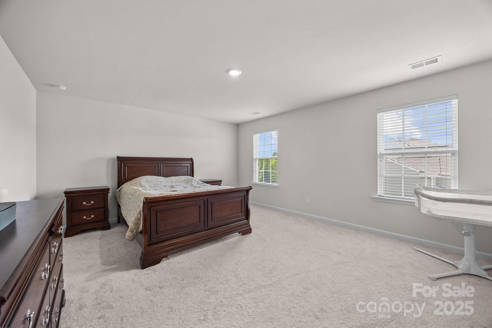 3643 Slider Terrace Lancaster, SC 29720 - Photo 13 of 46 a bedroom with a bed and window