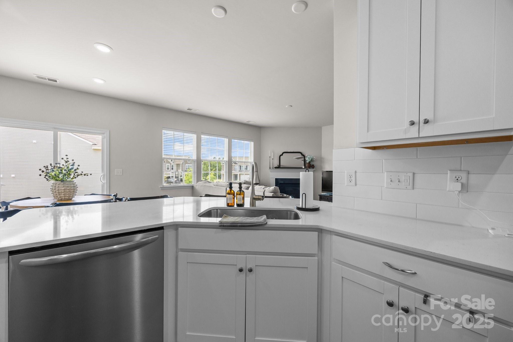 3643 Slider Terrace Lancaster, SC 29720 - Photo 16 of 46 a kitchen with stainless steel appliances white cabinets and a sink