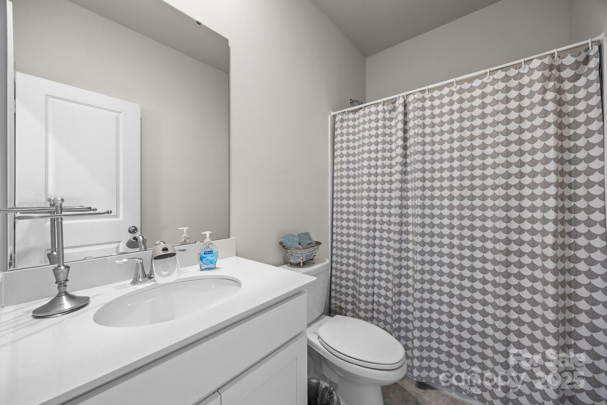 3643 Slider Terrace Lancaster, SC 29720 - Photo 18 of 46 a bathroom with a sink toilet and shower