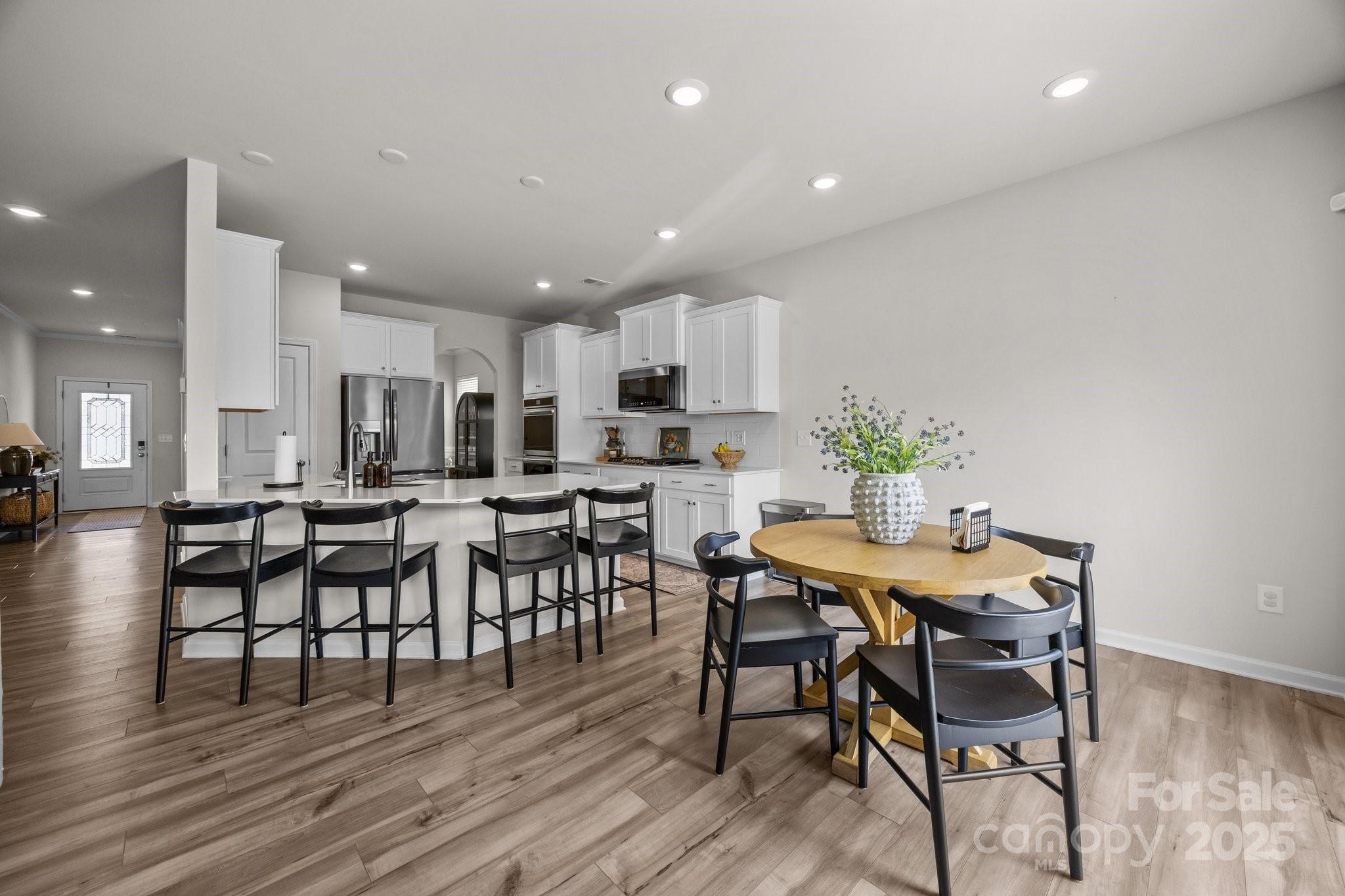 3643 Slider Terrace Lancaster, SC 29720 - Photo 2 of 46 a view of a dining room with furniture and wooden floor