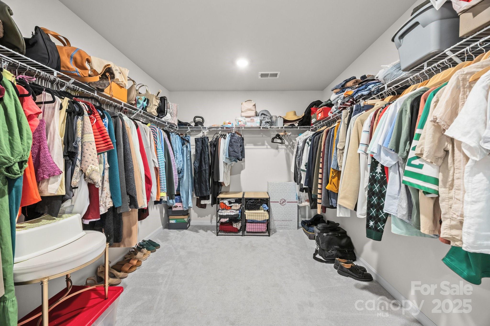 3643 Slider Terrace Lancaster, SC 29720 - Photo 35 of 46 a view of walk in closet with clothes and shoes