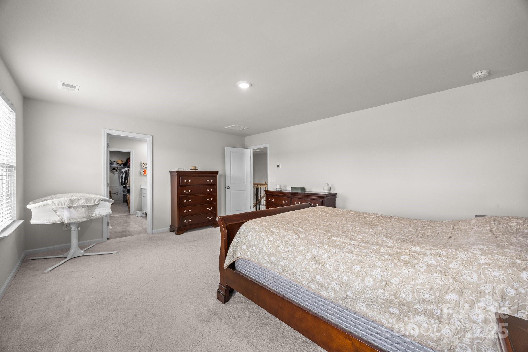 3643 Slider Terrace Lancaster, SC 29720 - Photo 4 of 46 a spacious bedroom with a bed and furniture