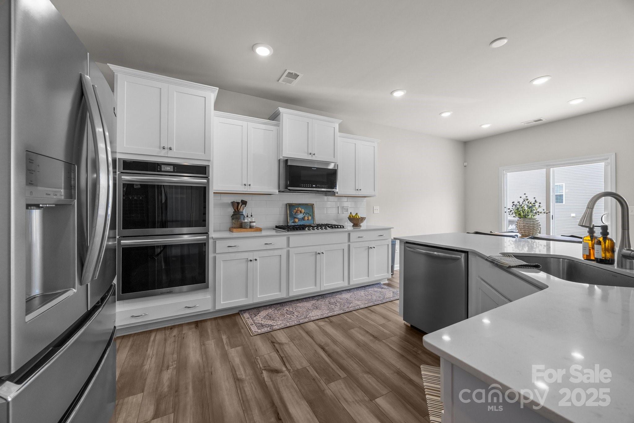 3643 Slider Terrace Lancaster, SC 29720 - Photo 5 of 46 a kitchen with granite countertop a refrigerator stove top oven and sink