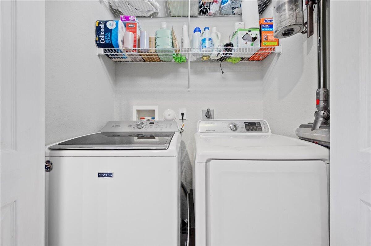 6430 Barbara Street Jupiter, FL 33458 - Photo 15 of 18 a utility room with dryer and washer