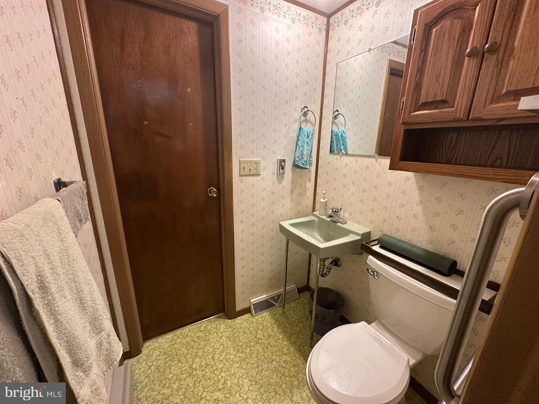 375 St Thomas-Edenville Road St. Thomas, PA 17252 - Photo 44 of 85 a bathroom with a sink a toilet a mirror and vanity